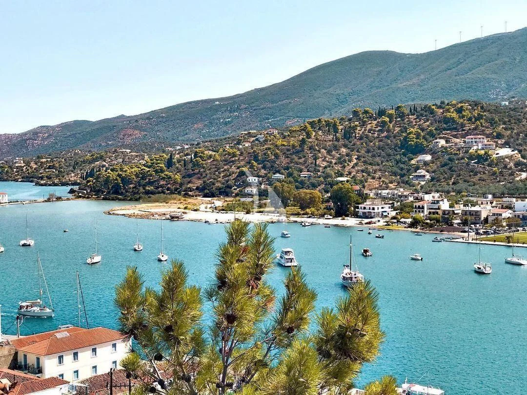 a body of water with boats and trees on it aboard KOUKLES Yacht for Sale
