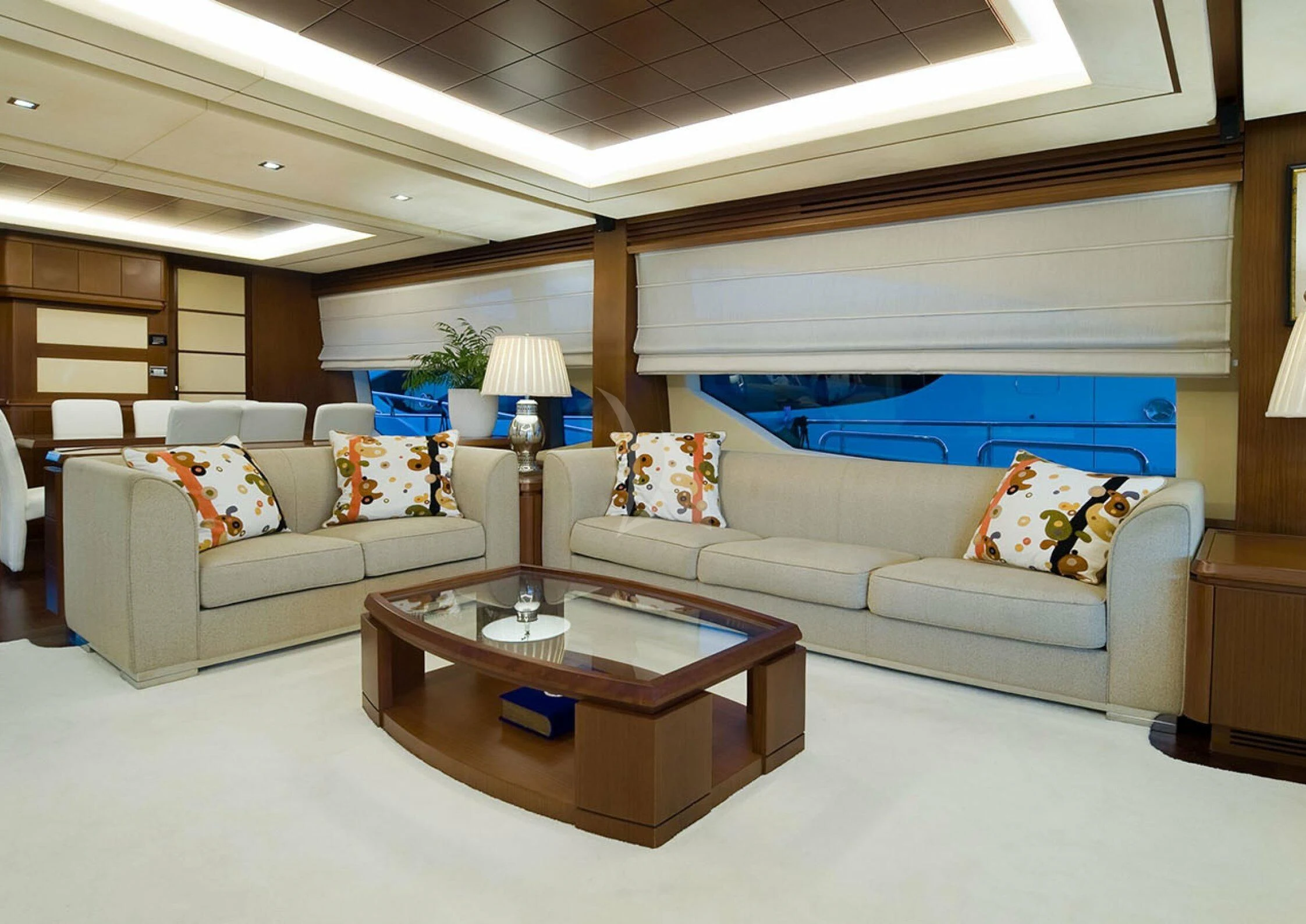 a living room with a couch and a coffee table aboard KOUKLES Yacht for Sale
