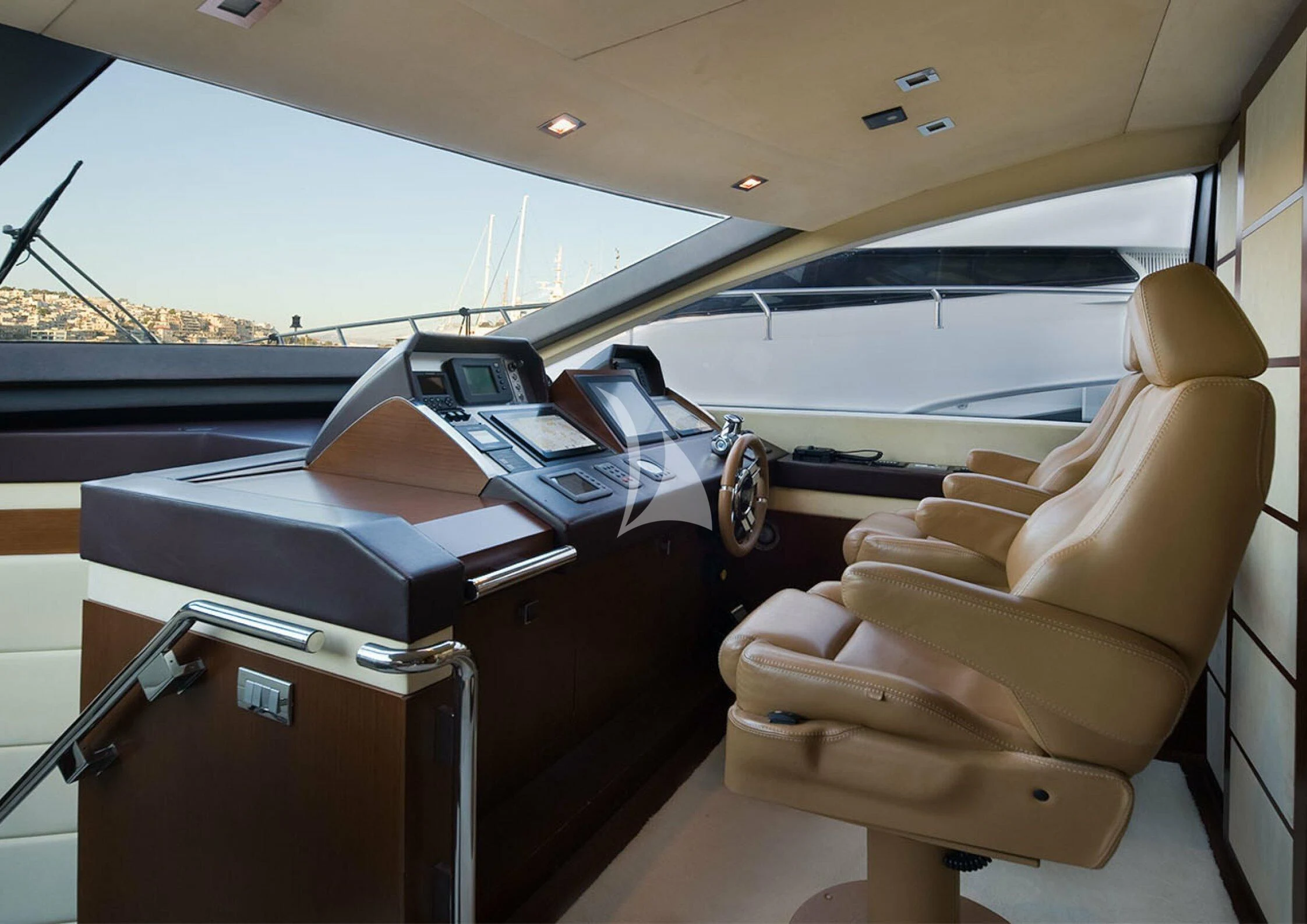 a car with a desk and chairs aboard KOUKLES Yacht for Sale