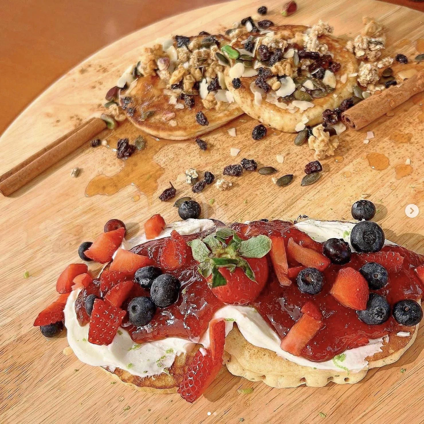 a pizza with pineapple and olives on it aboard KOUKLES Yacht for Sale