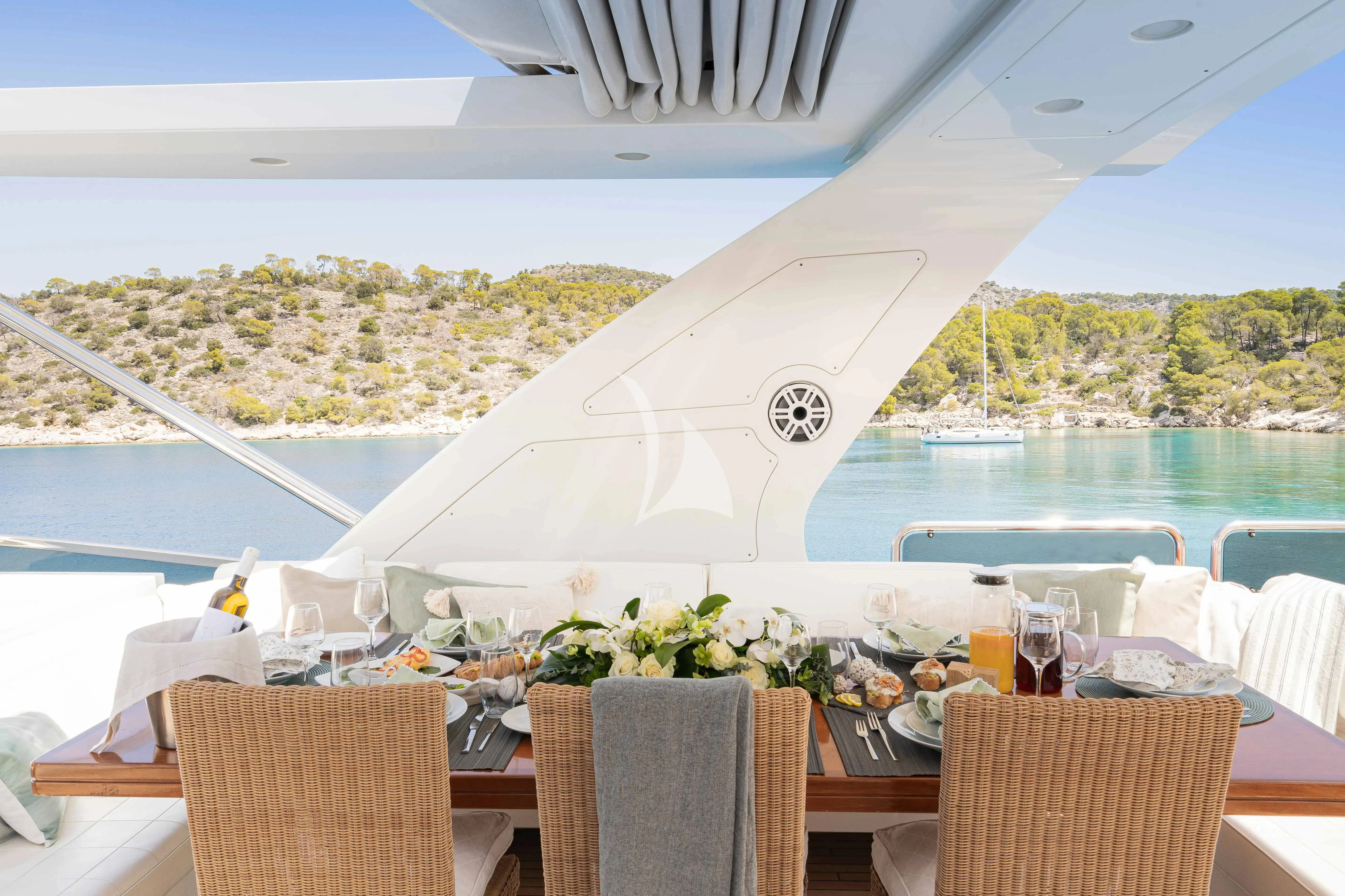 a table set for a meal on a boat aboard KOUKLES Yacht for Sale