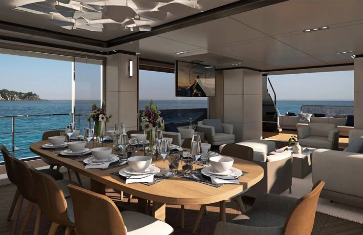 a dining table with chairs and a view of the ocean aboard VITTORIA VELOCE 32 RPH #01 Yacht for Sale