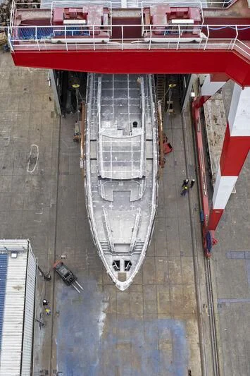 a white car in a parking lot aboard VITTORIA VELOCE 32 RPH #01 Yacht for Sale