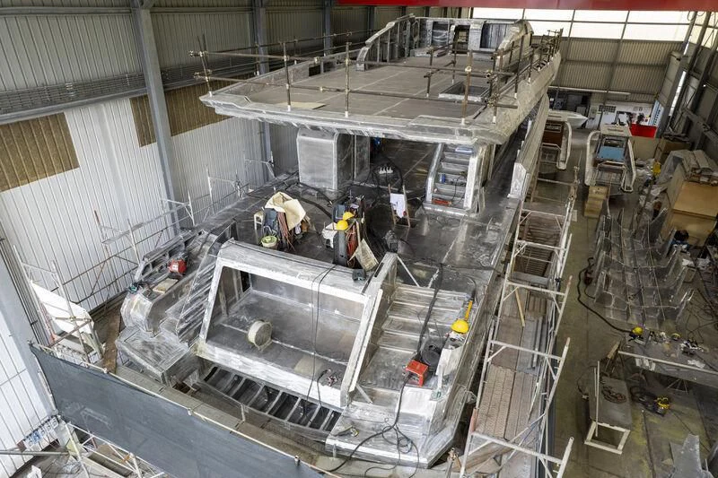 a group of people in a factory aboard VITTORIA VELOCE 32 RPH #01 Yacht for Sale