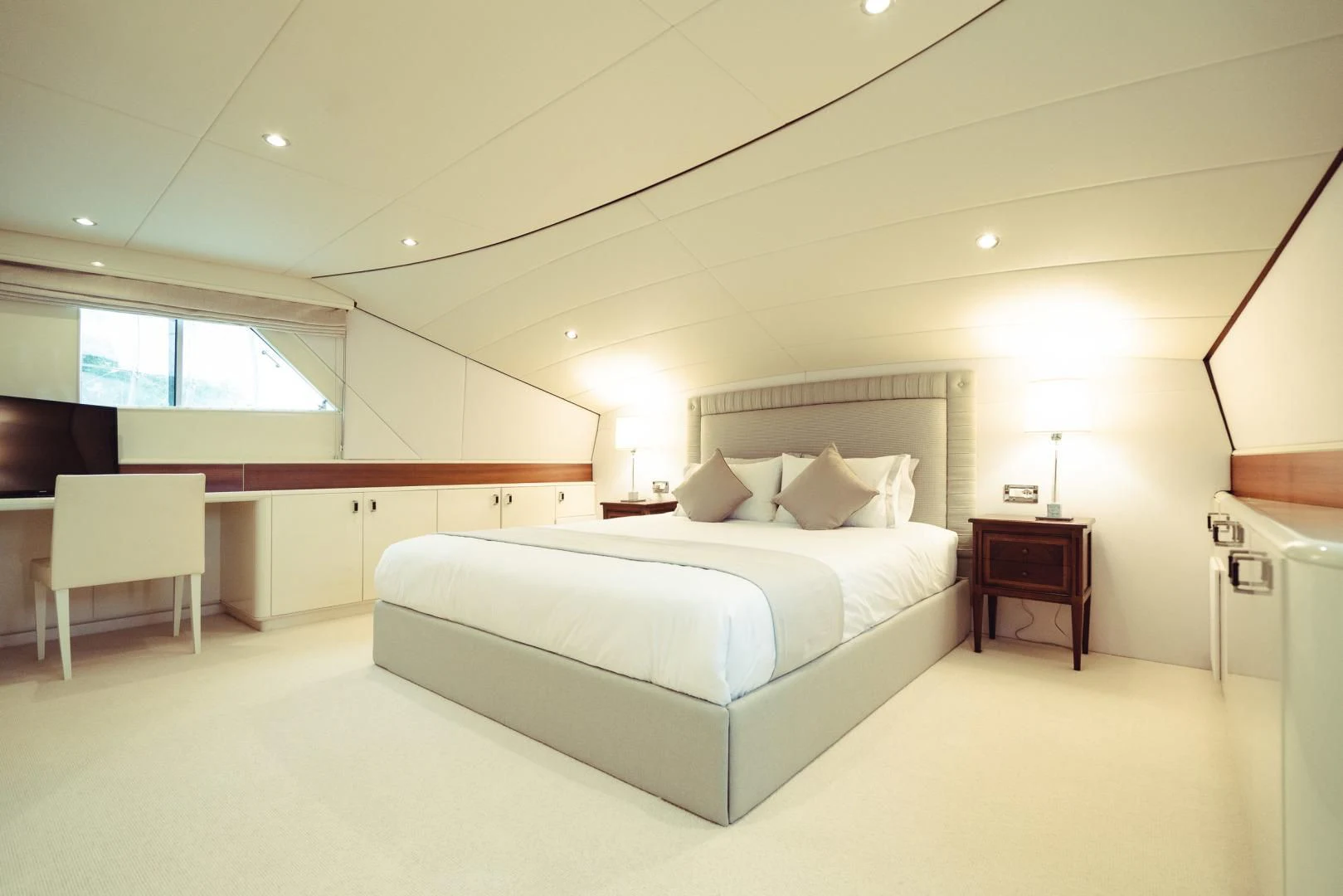 a large white bed in a room aboard WIZARD ONE Yacht for Sale