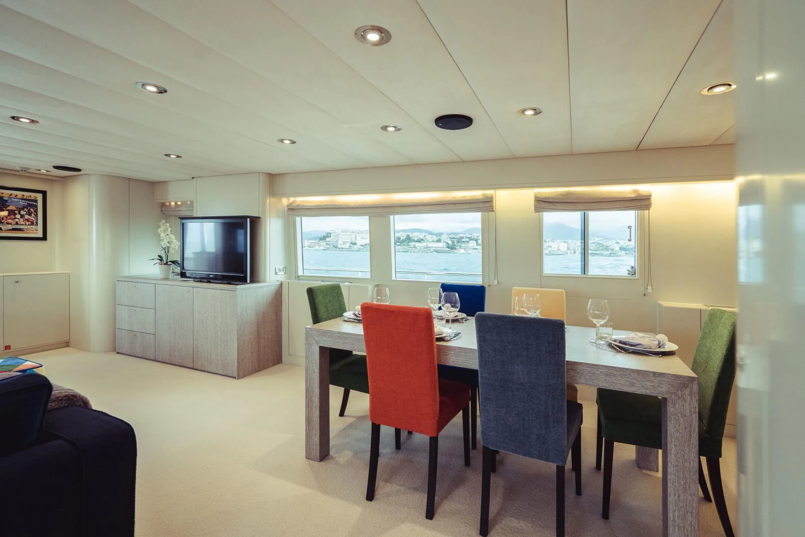 a dining room with a table and chairs aboard WIZARD ONE Yacht for Sale