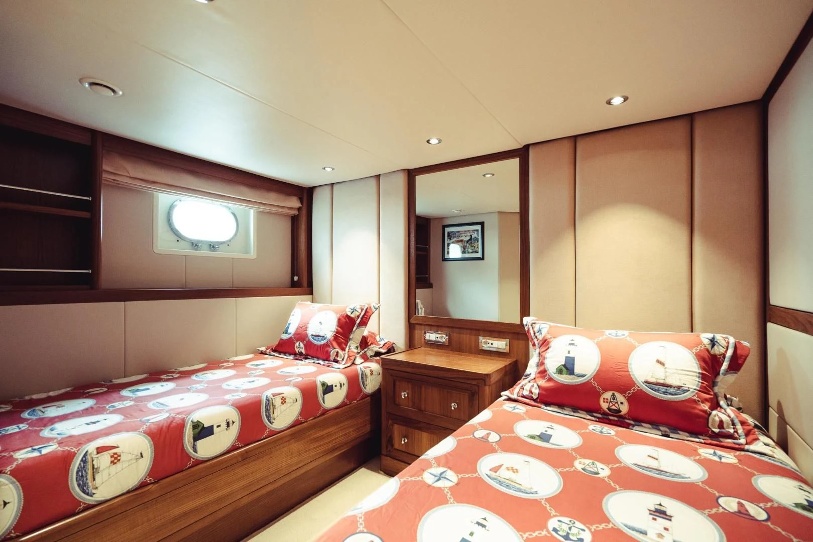 a bedroom with a bed and a dresser aboard WIZARD ONE Yacht for Sale