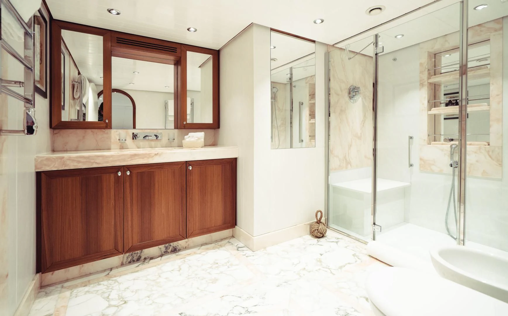 a bathroom with a glass shower aboard WIZARD ONE Yacht for Sale
