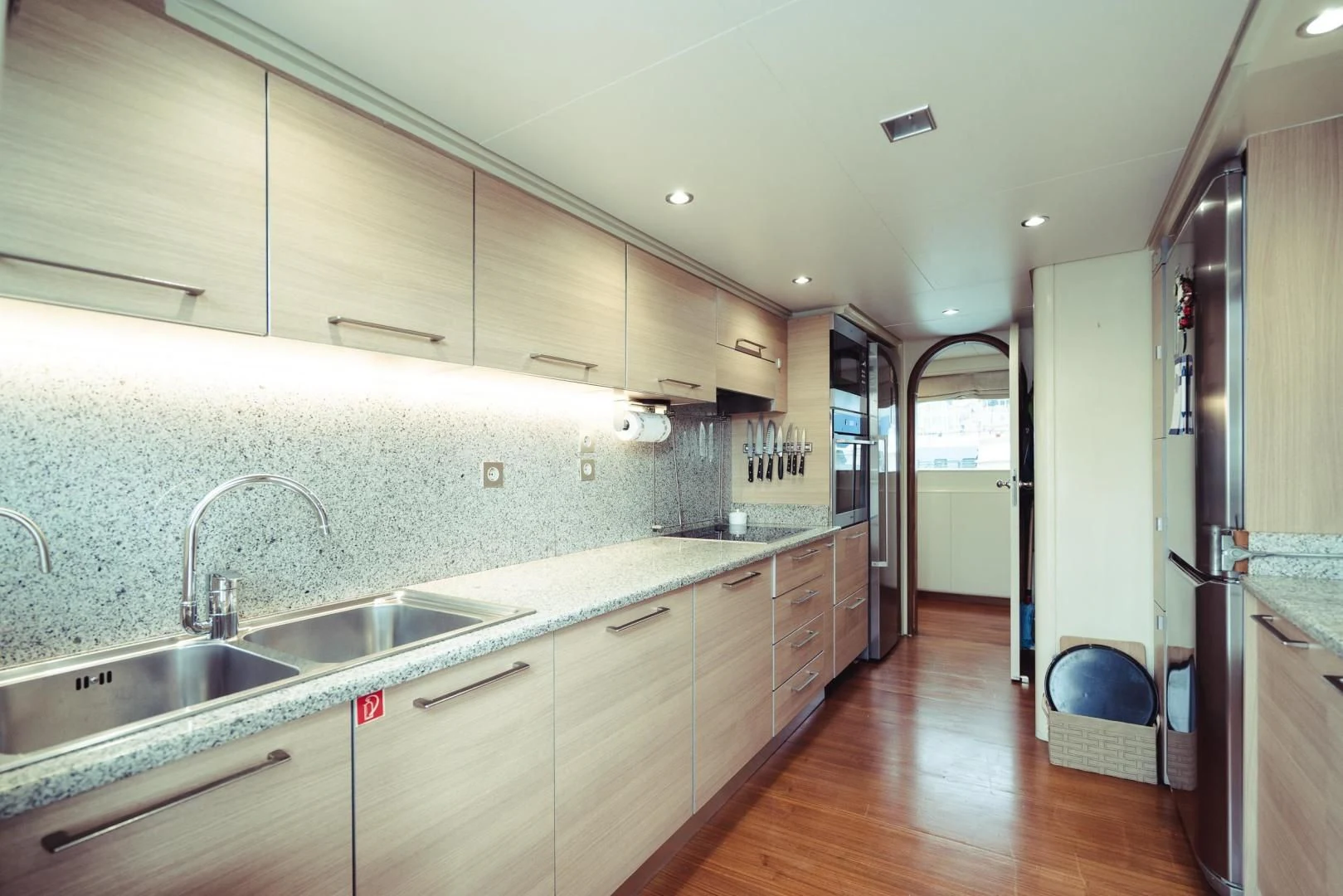 a kitchen with a large island aboard WIZARD ONE Yacht for Sale