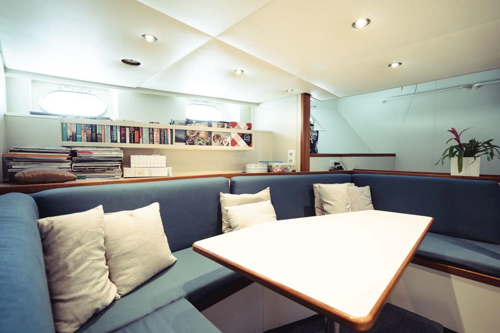 a room with a couch and a table aboard WIZARD ONE Yacht for Sale