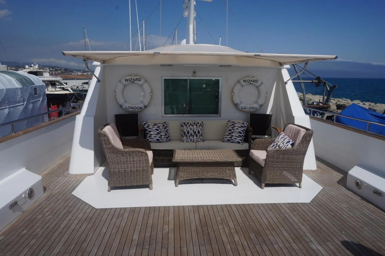 a living room with a boat aboard WIZARD ONE Yacht for Sale