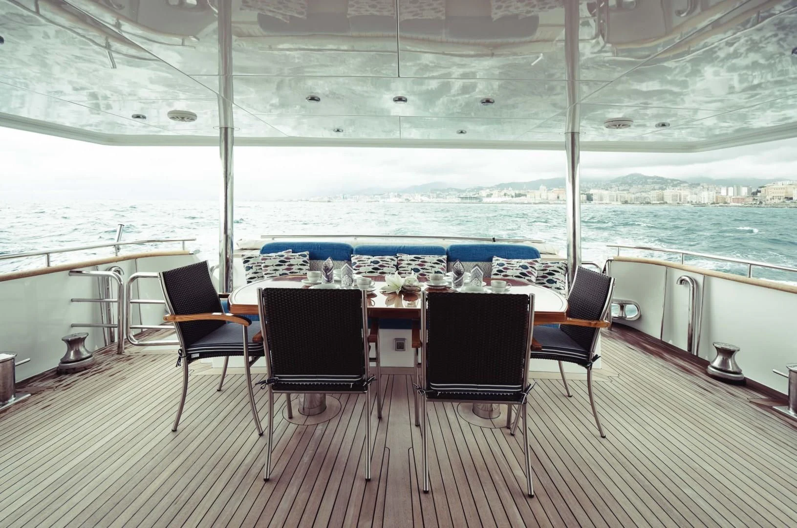 a table and chairs on a deck aboard WIZARD ONE Yacht for Sale