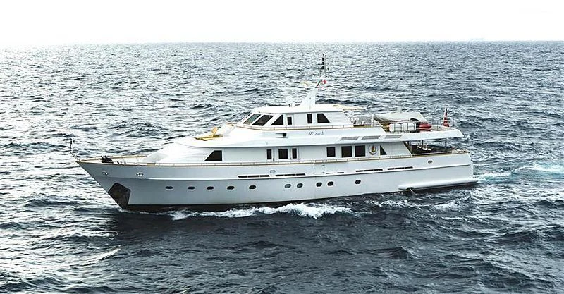 a large white boat in the water aboard WIZARD ONE Yacht for Sale