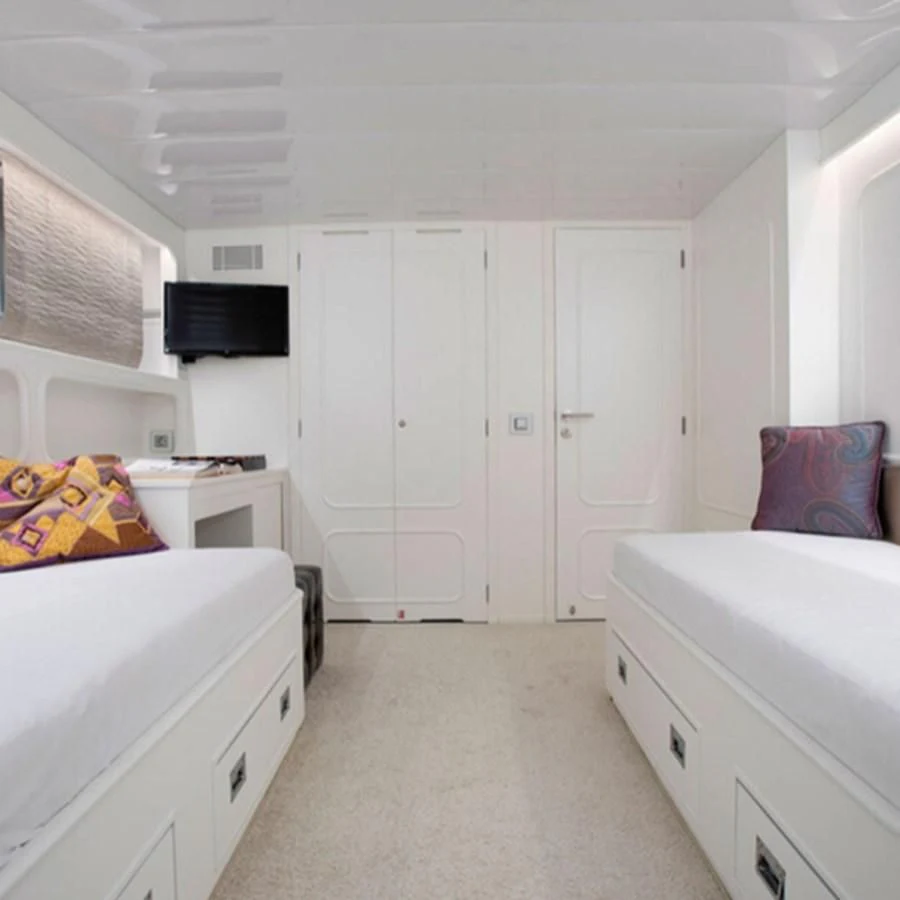 a small white kitchen aboard RA Yacht for Sale