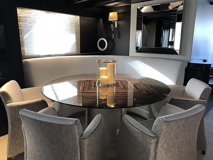 a table with candles on it aboard RA Yacht for Sale