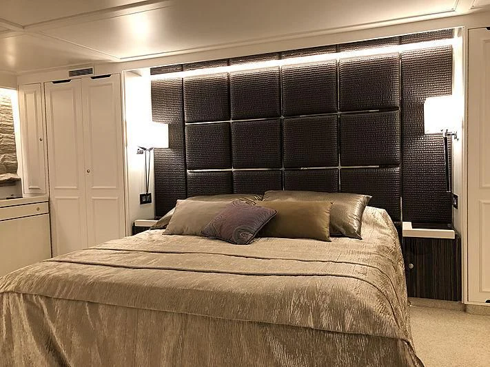 a bed with a blackboard aboard RA Yacht for Sale