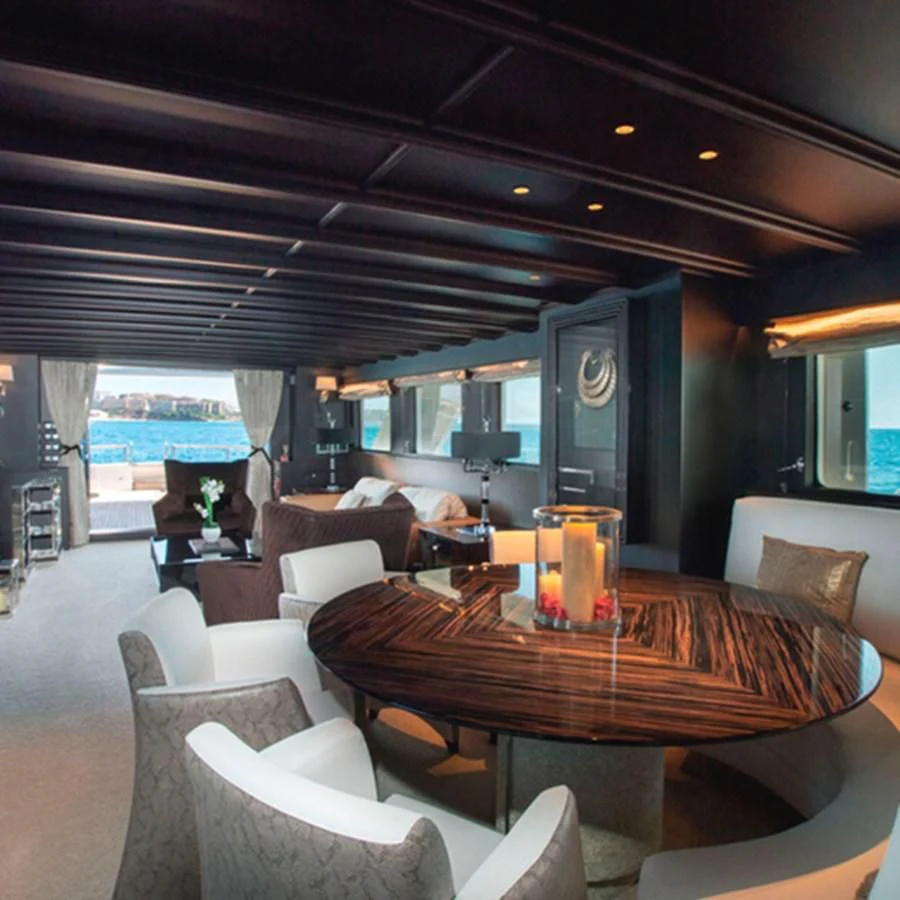 a table with candles on it aboard RA Yacht for Sale