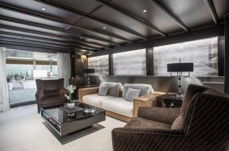 a living room with a large window aboard RA Yacht for Sale