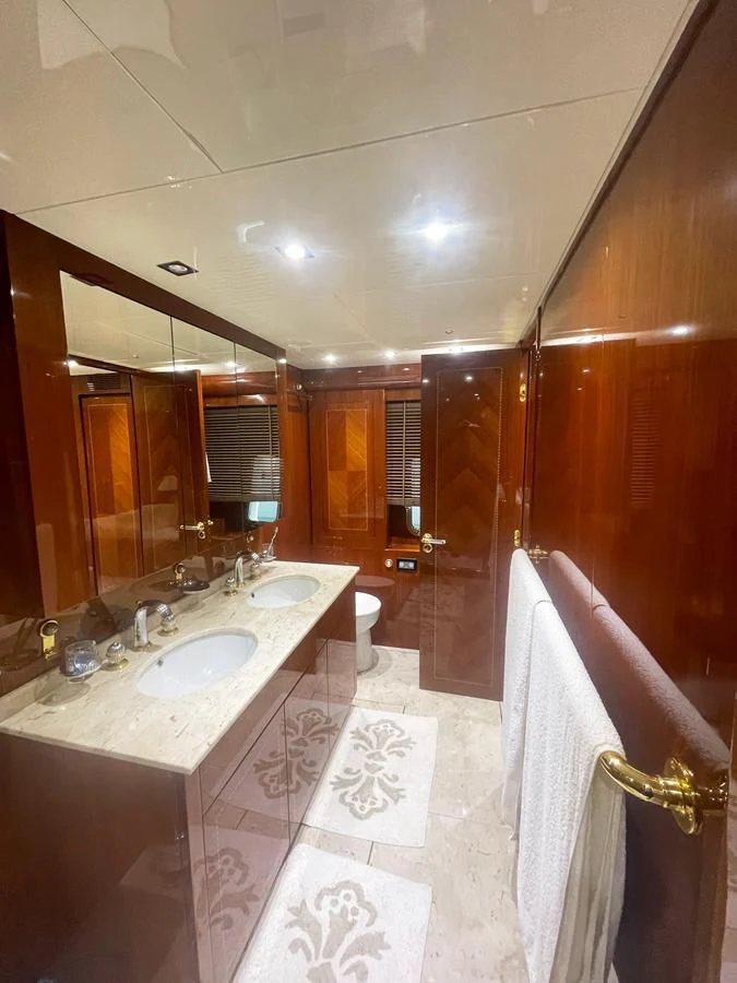 a bathroom with a sink and a mirror aboard NAISCA IV Yacht for Sale