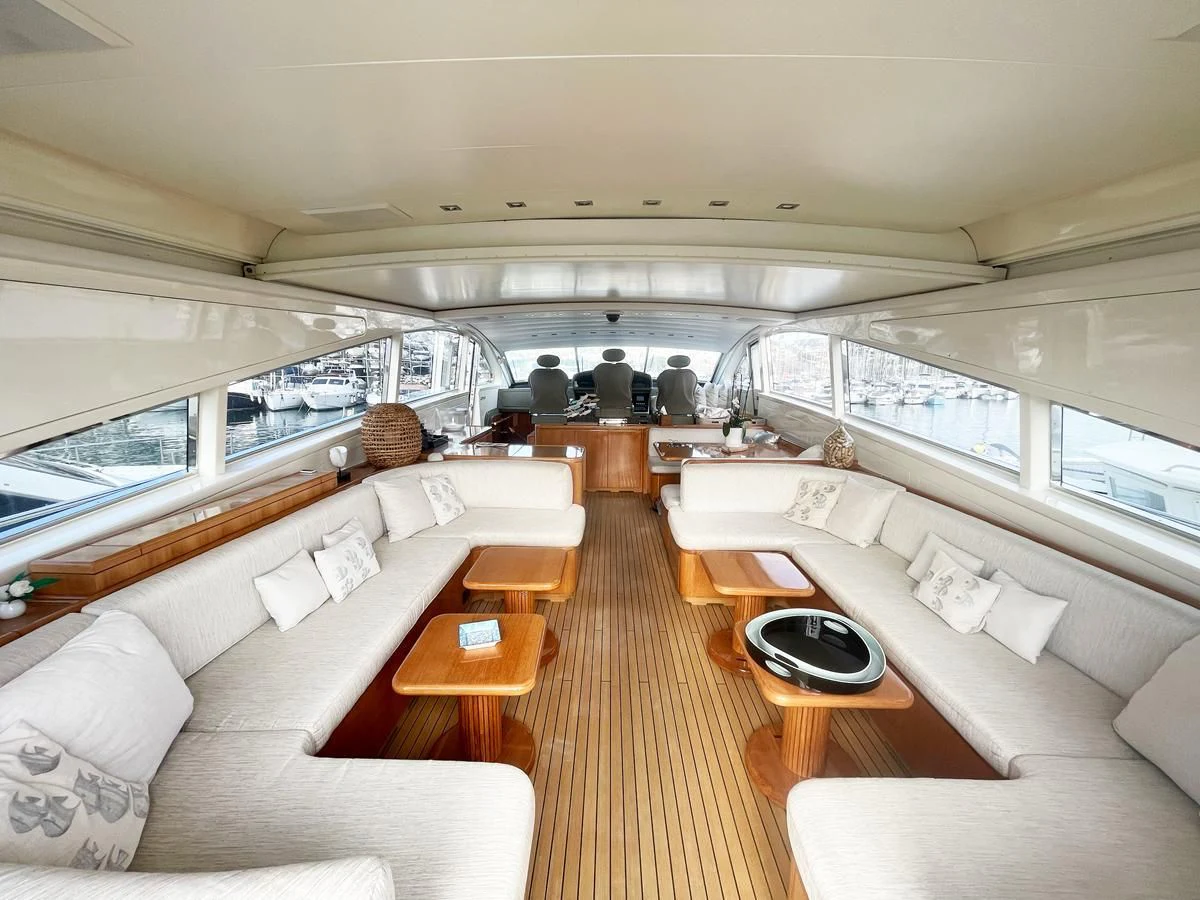 a living room with a large window aboard NAISCA IV Yacht for Sale