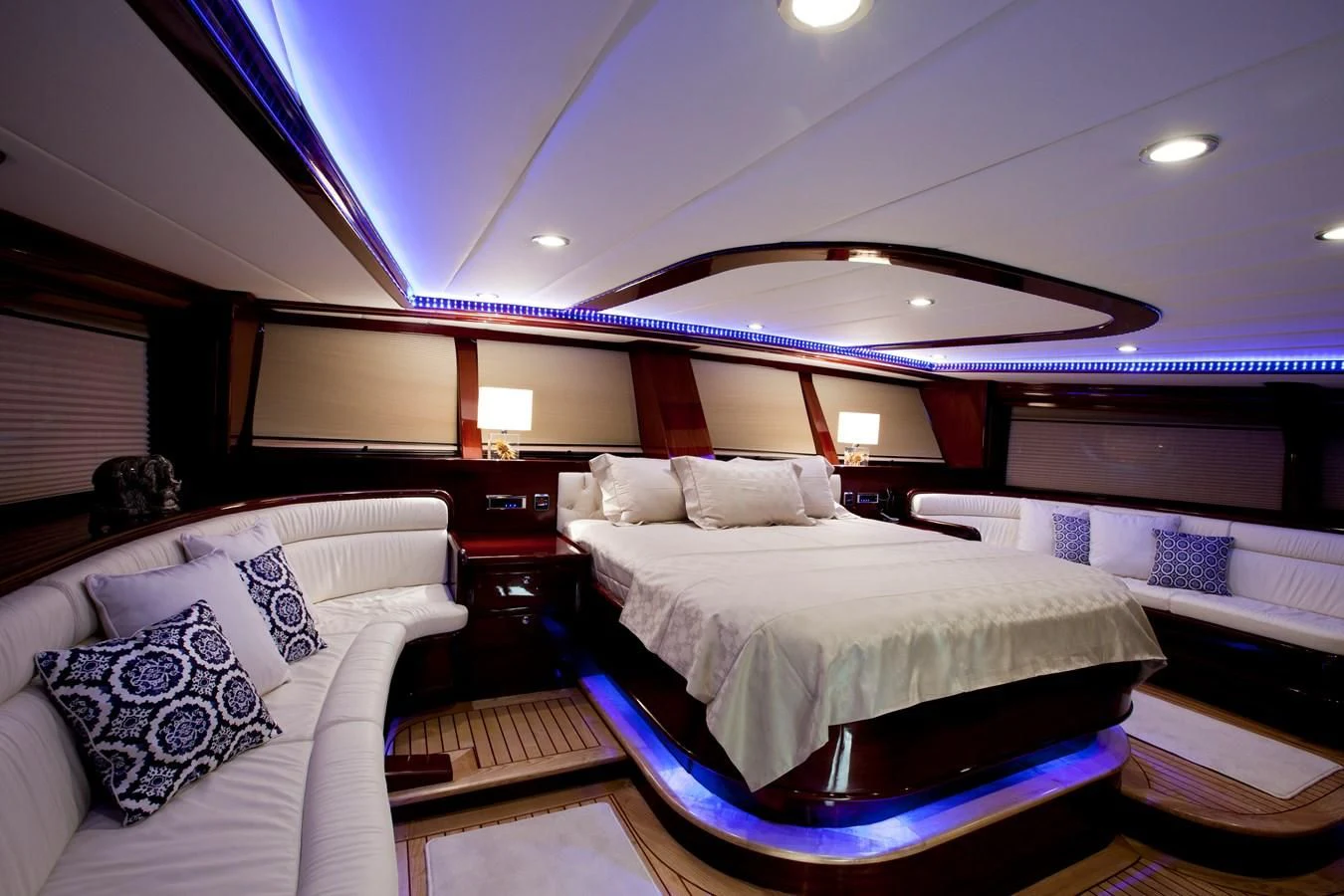 a room with a bed and a large window aboard PERFORMANCE FEE Yacht for Sale