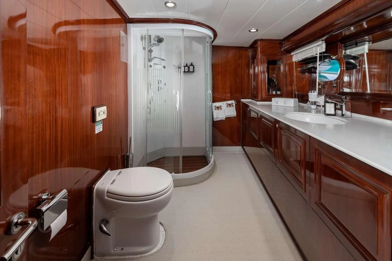 a bathroom with a shower and toilet aboard PERFORMANCE FEE Yacht for Sale