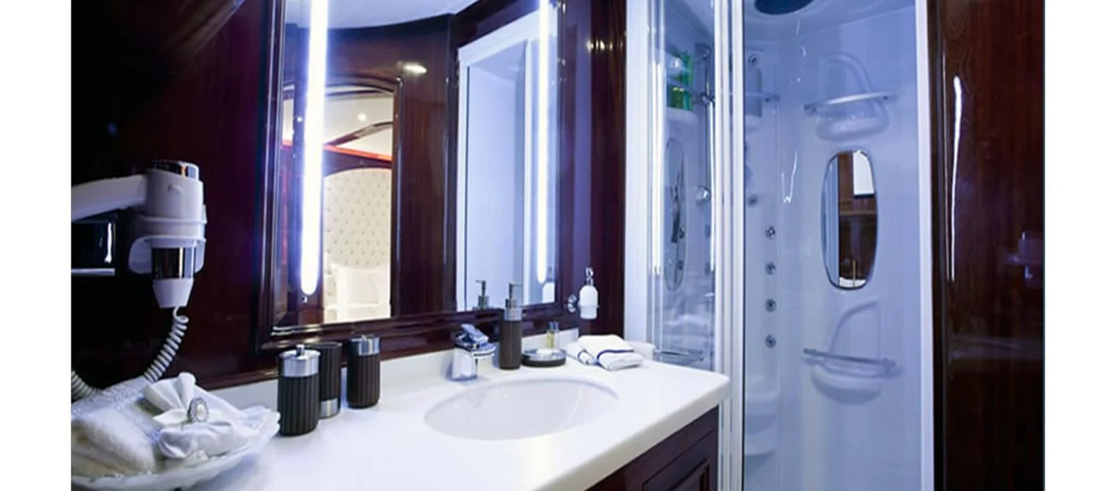 a bathroom with a sink and a mirror aboard PERFORMANCE FEE Yacht for Sale