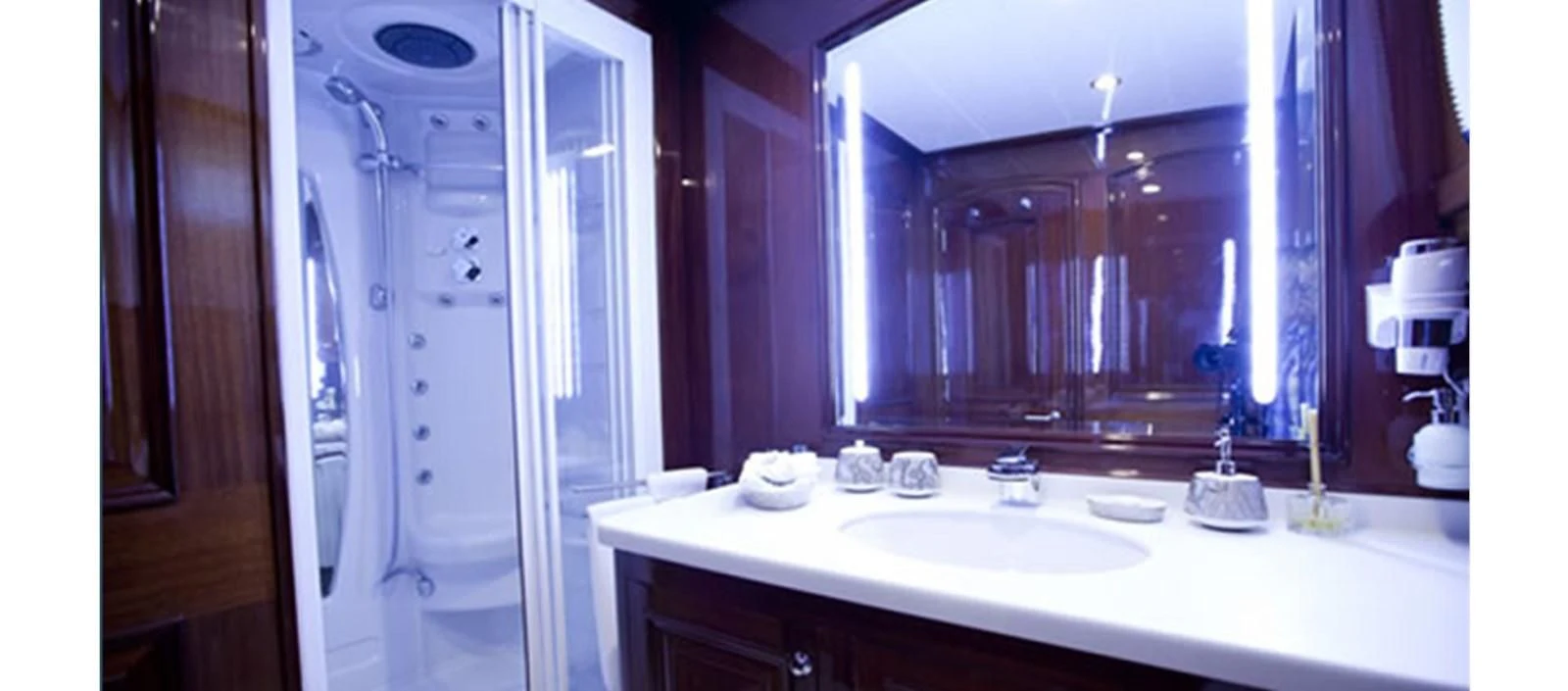 a bathroom with a large mirror aboard PERFORMANCE FEE Yacht for Sale