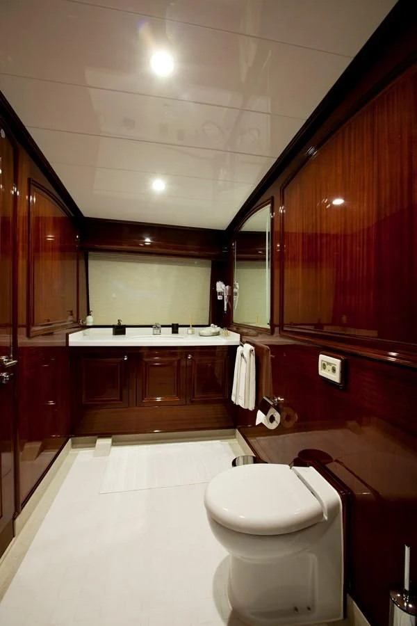 a bathroom with a toilet and a sink aboard PERFORMANCE FEE Yacht for Sale
