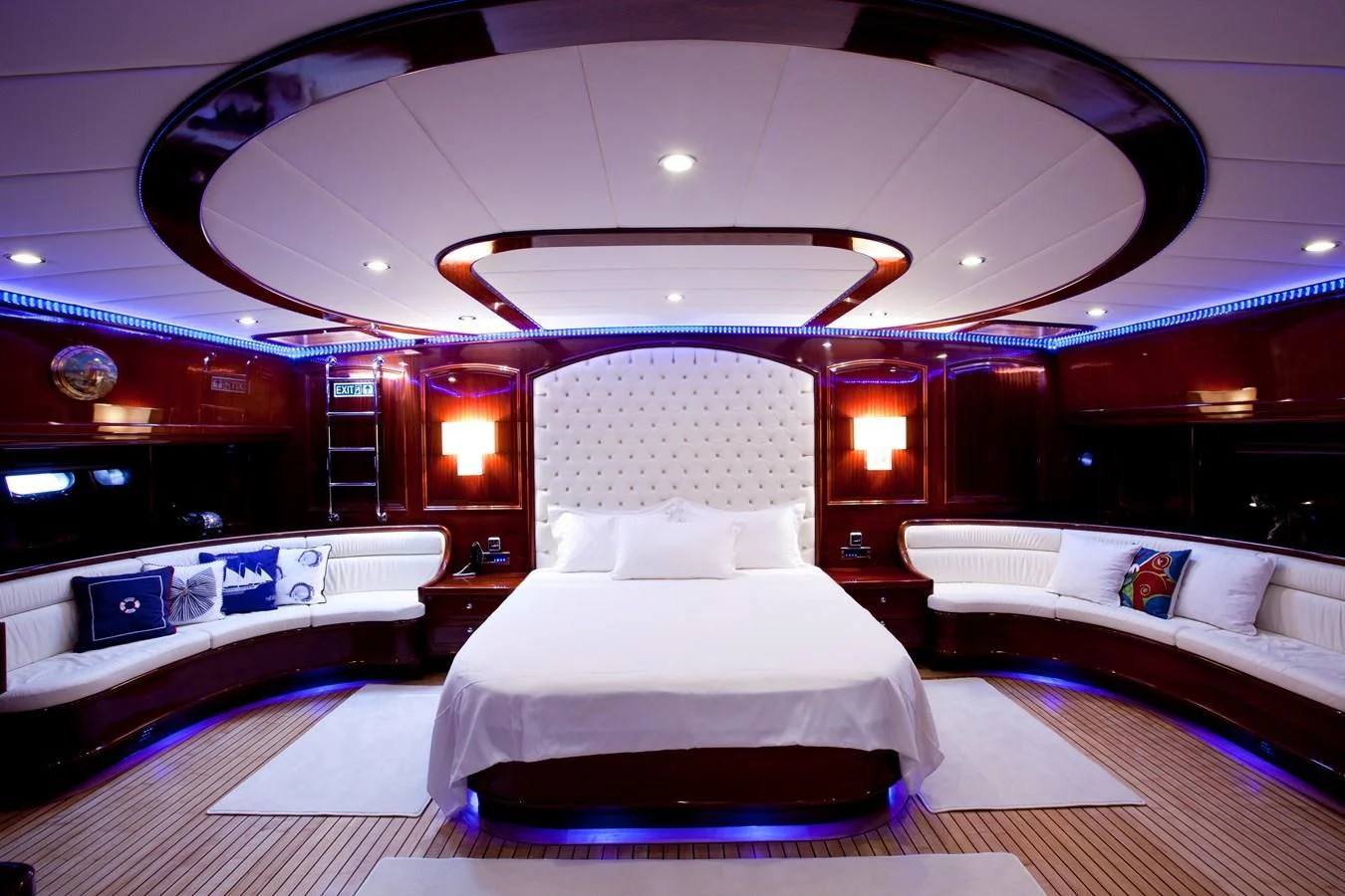 a room with a bed and a large mirror aboard PERFORMANCE FEE Yacht for Sale