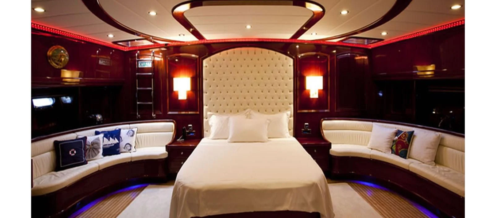 a room with beds and a television aboard PERFORMANCE FEE Yacht for Sale
