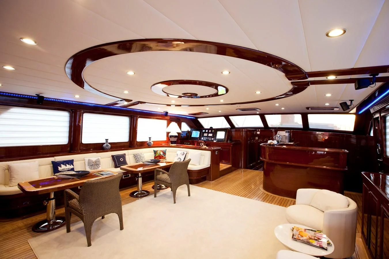 a room with tables and chairs aboard PERFORMANCE FEE Yacht for Sale