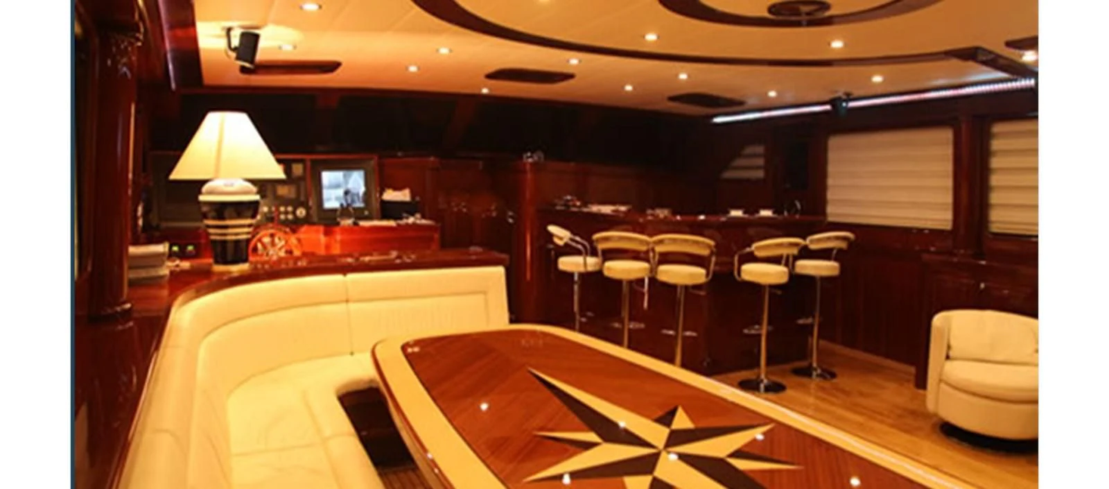 a room with tables and chairs aboard PERFORMANCE FEE Yacht for Sale