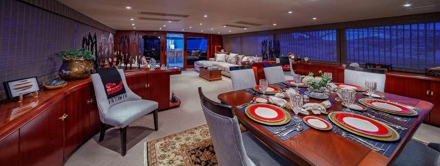 a large dining room with a table and chairs aboard BLACKWOOD Yacht for Sale