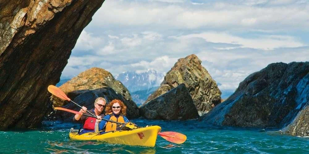 a couple of people in a kayak in a body of water aboard BLACKWOOD Yacht for Sale