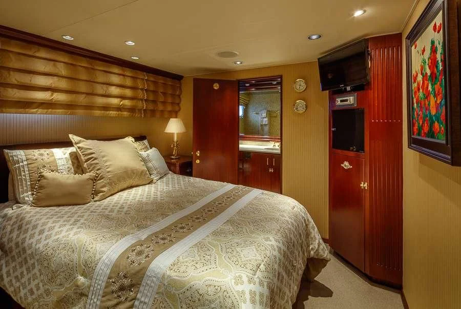 a bed in a hotel room aboard BLACKWOOD Yacht for Sale