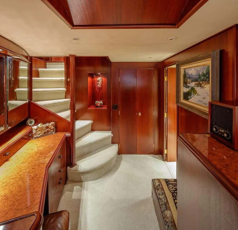 a room with wooden furniture aboard BLACKWOOD Yacht for Sale