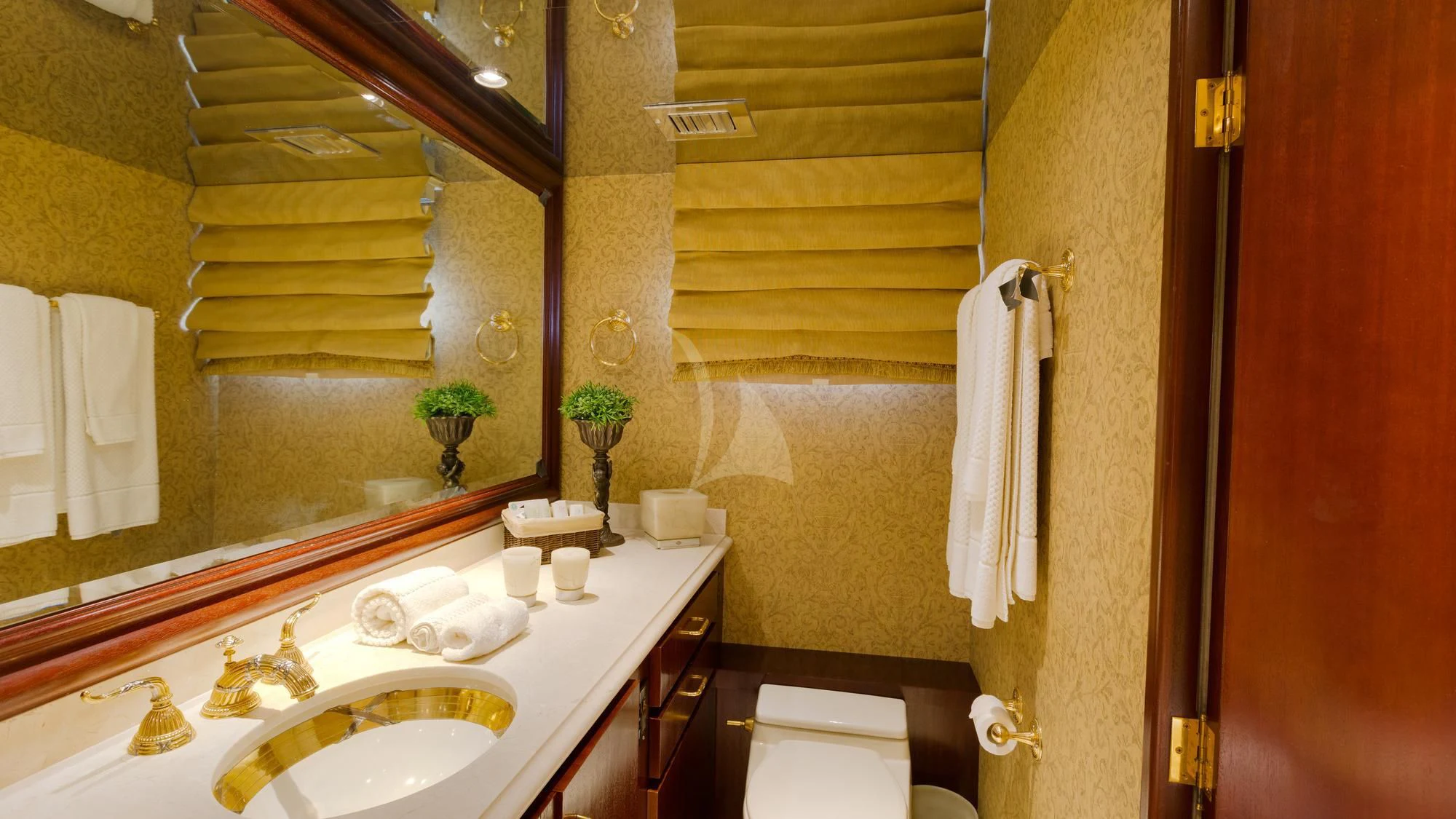 a bathroom with a sink and a toilet aboard BLACKWOOD Yacht for Sale