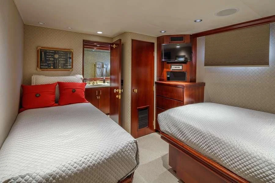 a couple of beds in a hotel room aboard BLACKWOOD Yacht for Sale