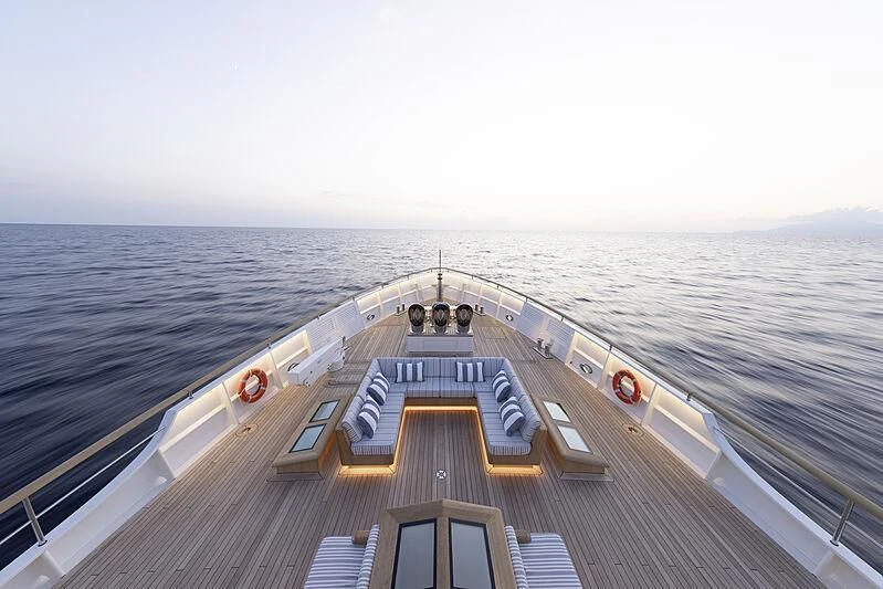 a wooden boat on a body of water aboard BLUE II Yacht for Charter