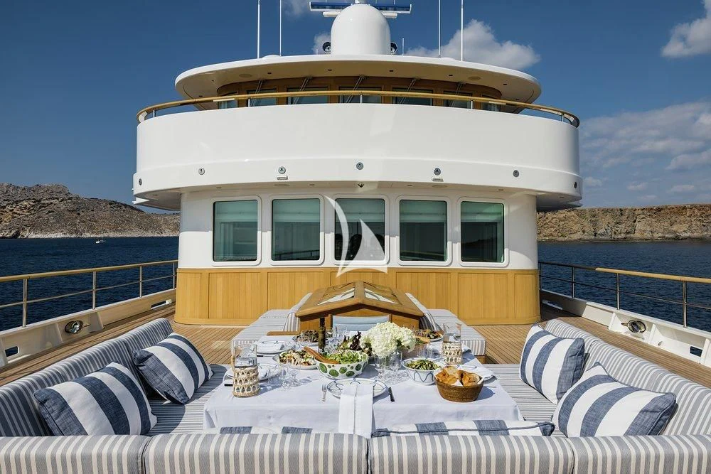 a white house with a white roof aboard BLUE II Yacht for Charter