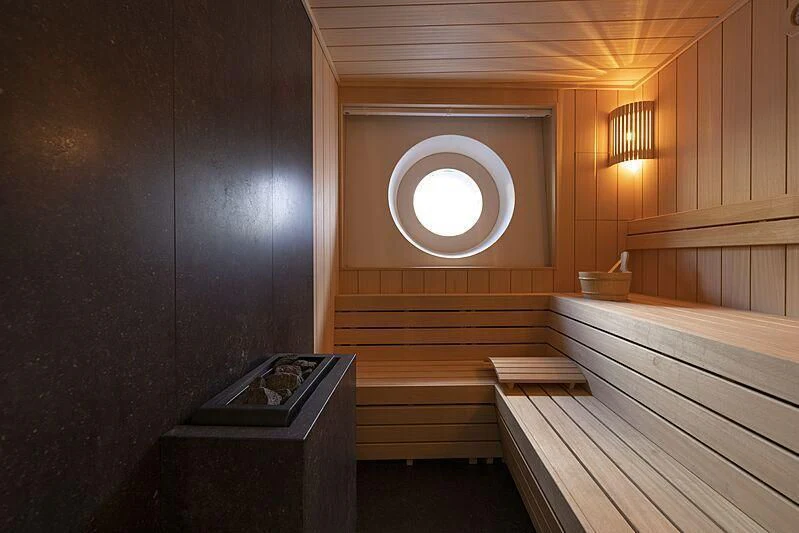 a wooden sauna with a large window aboard BLUE II Yacht for Charter