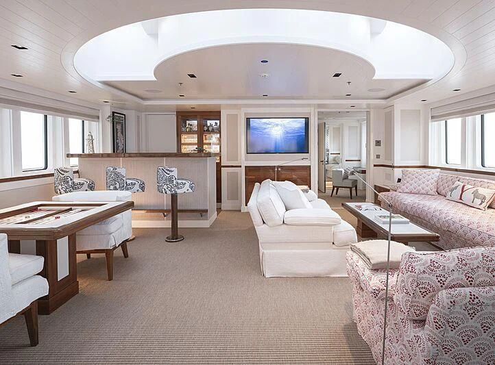 a living room with a large window aboard BLUE II Yacht for Charter