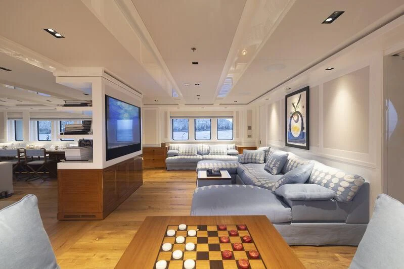 a living room with a large window aboard BLUE II Yacht for Charter