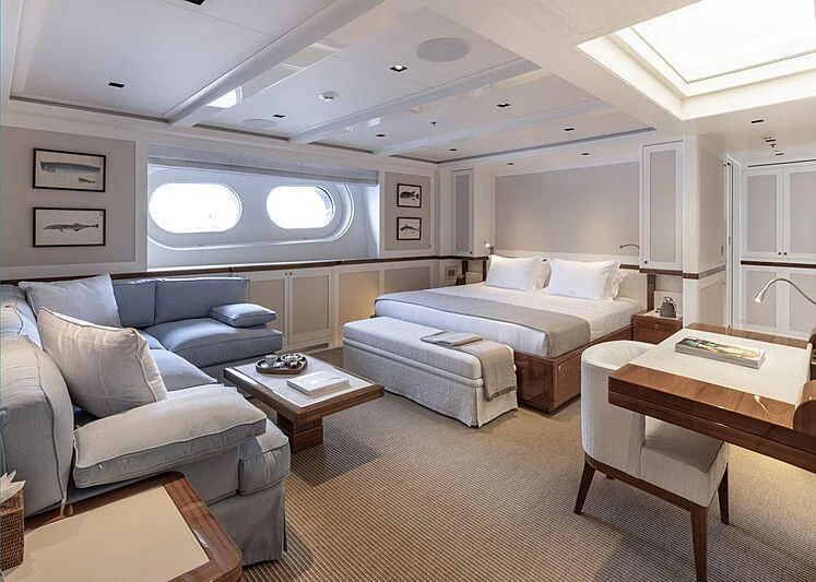 a living room with a couch and a table aboard BLUE II Yacht for Charter