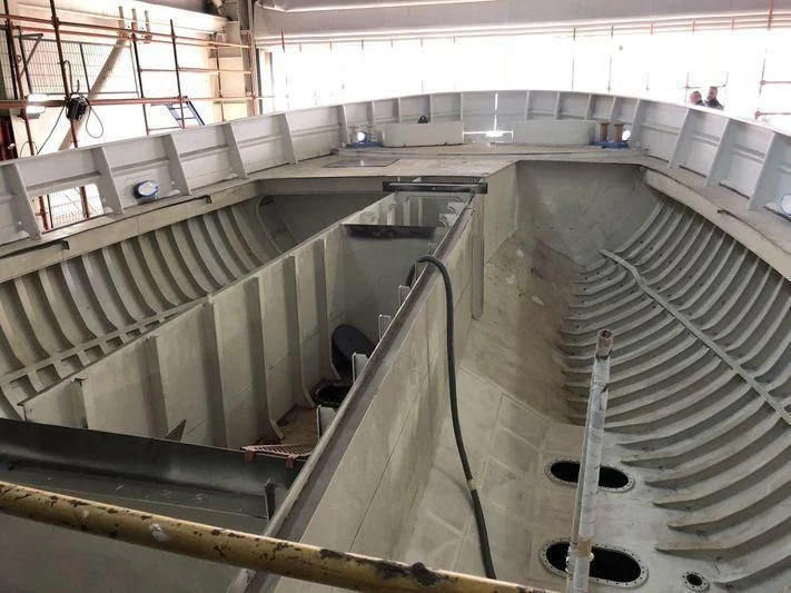 a large factory with pipes aboard BLUE II Yacht for Charter