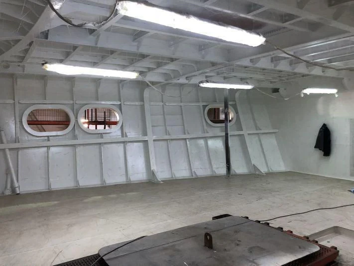 a room with a large wall aboard BLUE II Yacht for Charter