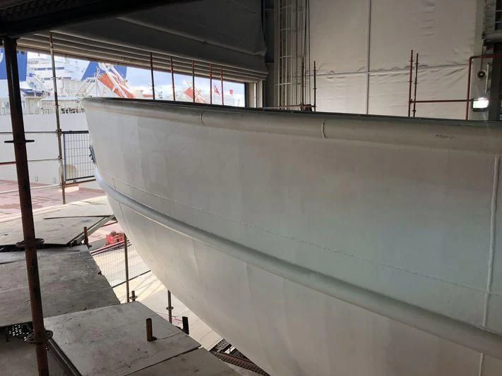 a large white boat in a large room aboard BLUE II Yacht for Charter