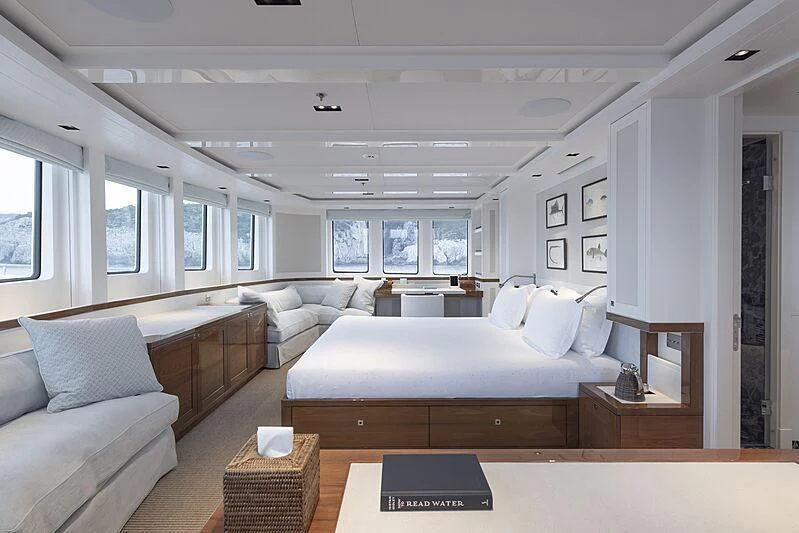 a large living room with a large bed and a couch aboard BLUE II Yacht for Charter