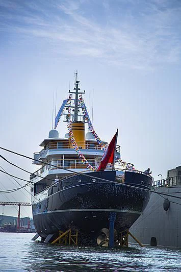 a large ship in the water aboard BLUE II Yacht for Charter